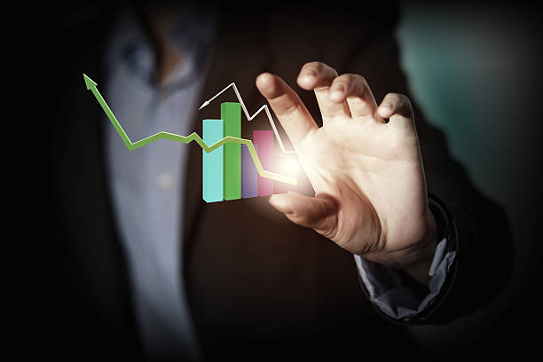 Close up of businesswoman holding graphs in hand